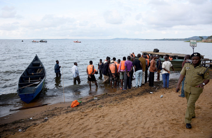 Rescue and recovery missions gather at the shores of Lake Victoria during the search for the bodies of dead passengers after 