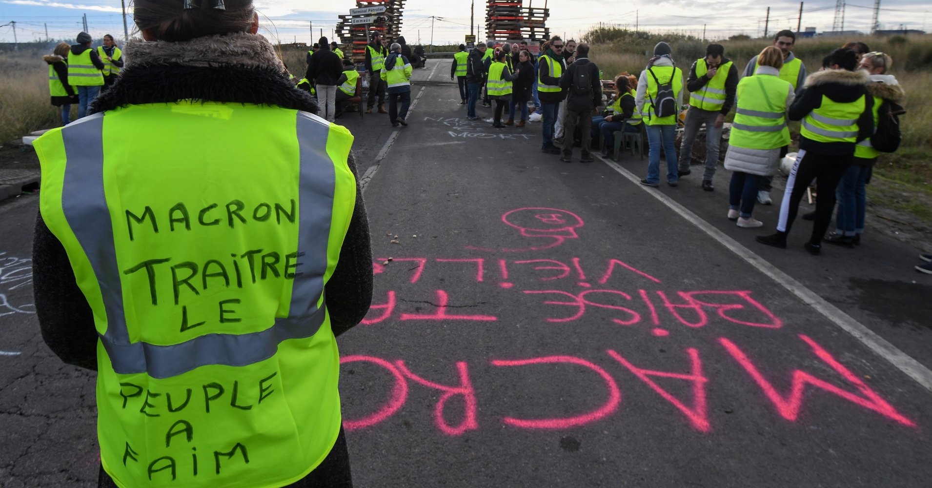  Macron Set To Suspend Fuel Tax Increase To End French 'Yellow Vest' Protests