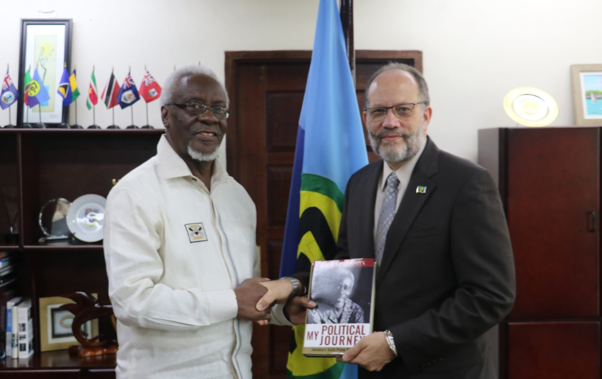 Former Jamaica Prime Minister presents copy of new book to CARICOM Secretary-General