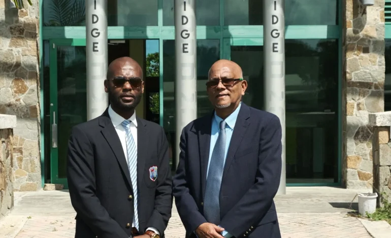 CWI President Dr Kishore Shallow congratulates Vice President Azim Bassarath and former West Indies player Samuel Badree on T&T’s prestigious Hummingbird Medal, Gold Award